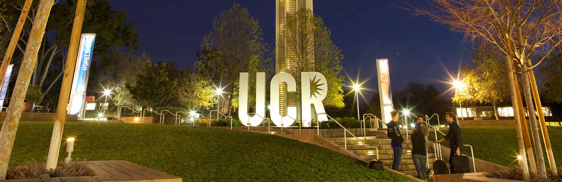 UCR sign and bell tower at night
