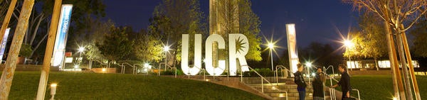 UCR sign and tower at night