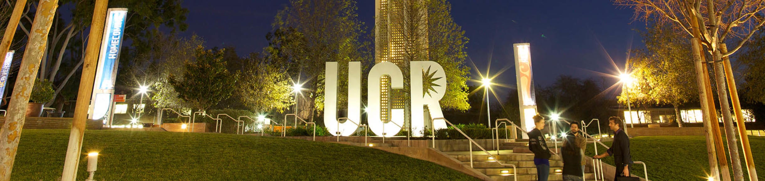 UCR sign and tower at night